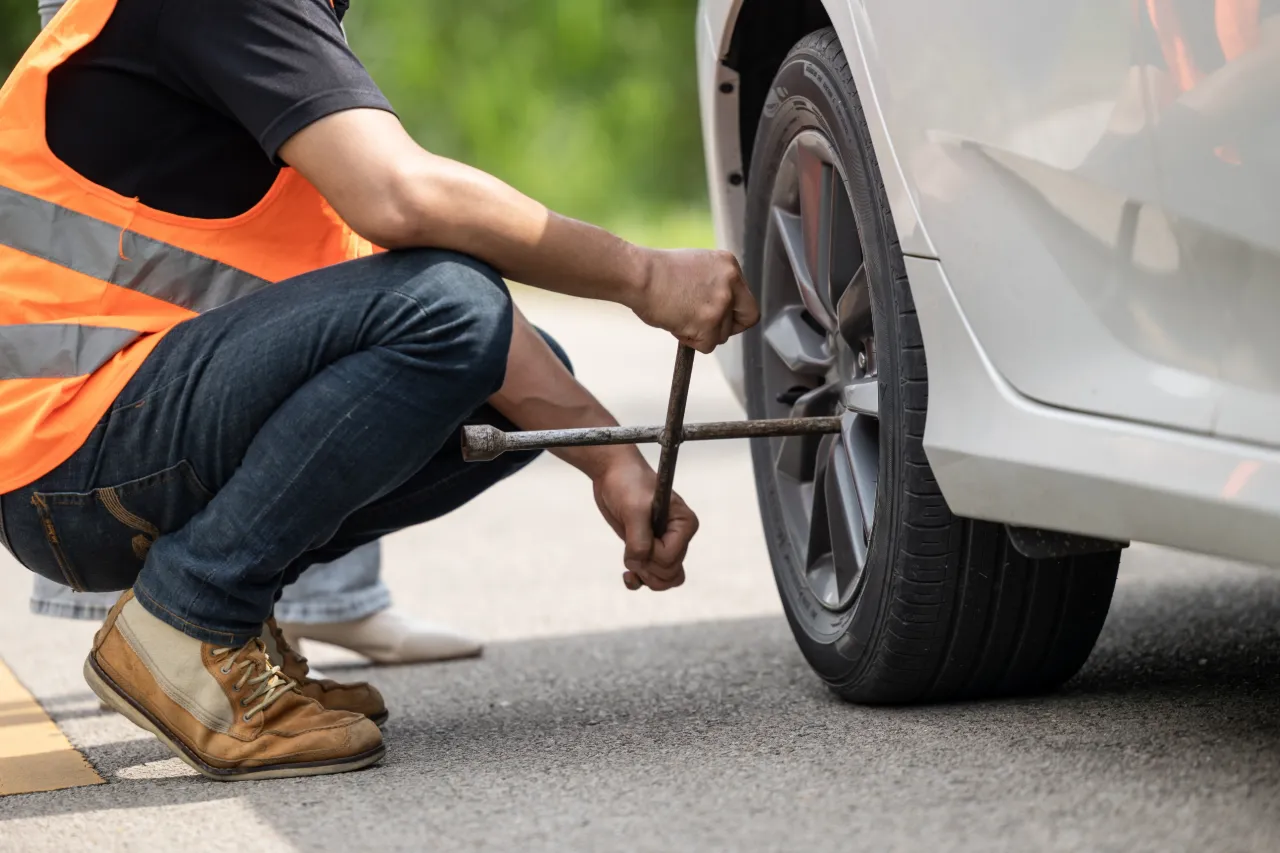 A car being fixed by a breakdown technician