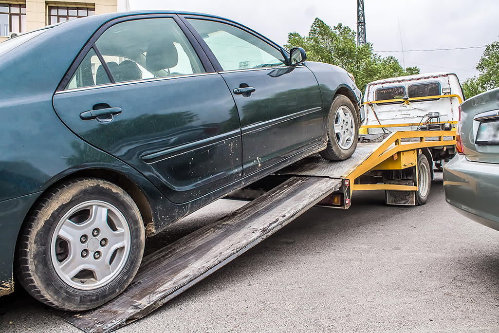 A car being towed away after a breakdown